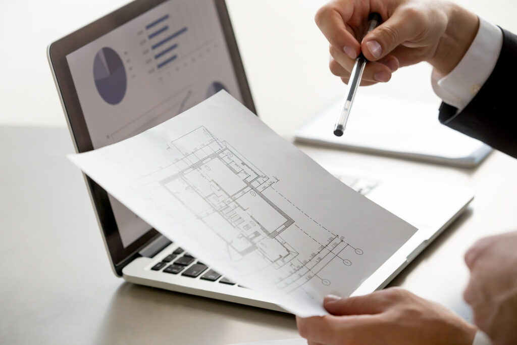 A Surveyor Holding RICS Guidance Certified Documents For Expert Witness Services