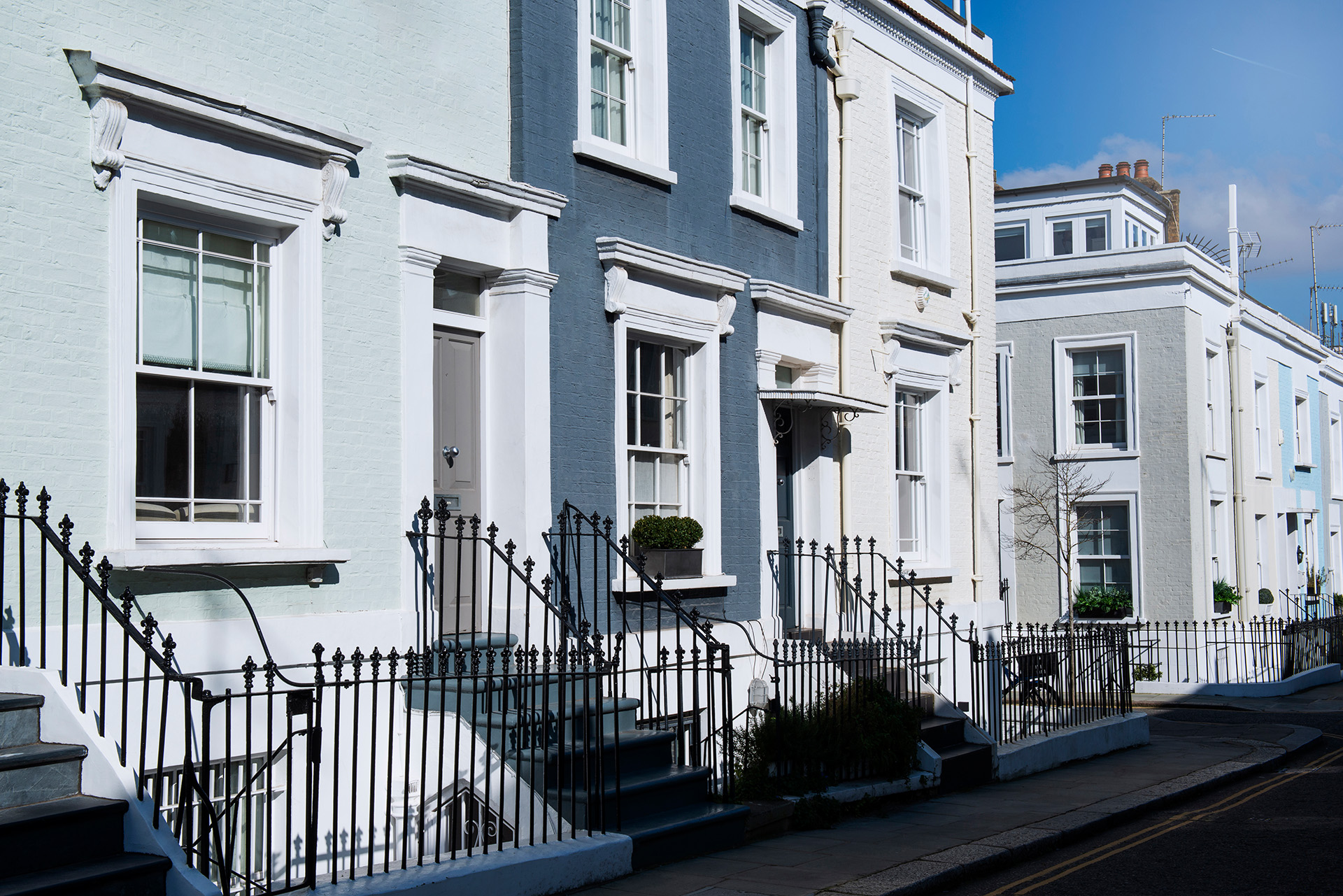 A Row of Colourful Terraced Houses As Independent Residential Survey Commences